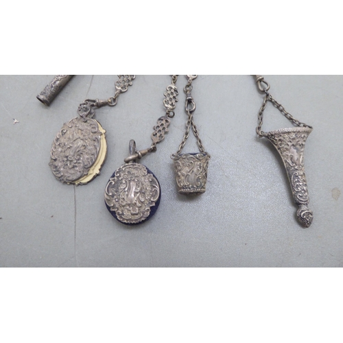 264 - A late 19th/early 20thC decoratively cast white metal chatelaine, comprising a belt hook and four pe... 