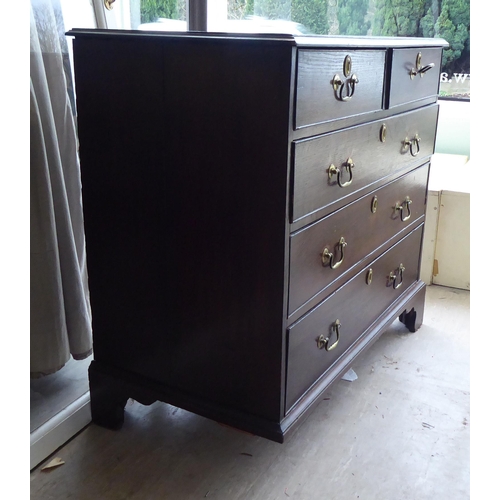 27 - A 19thC oak dressing chest, comprising two short/three long drawers with brass bail handles, raised ... 