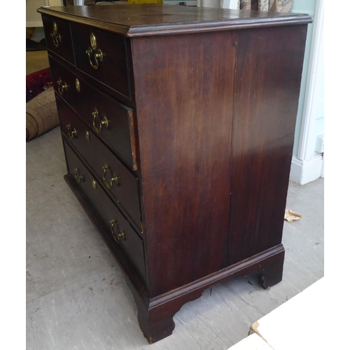 27 - A 19thC oak dressing chest, comprising two short/three long drawers with brass bail handles, raised ... 