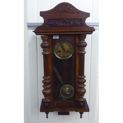 271 - A late 19thC walnut cased Vienna regulator; the spring driven pendulum movement faced by a two part ... 