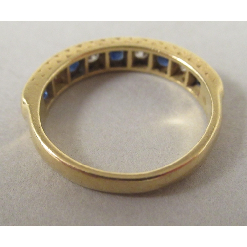 28 - An 18ct gold sapphire and diamond eternity ring 