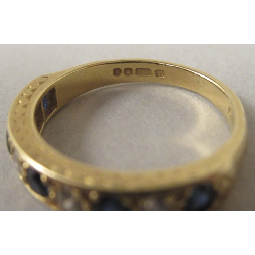 28 - An 18ct gold sapphire and diamond eternity ring 