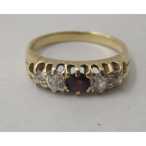 285 - An 18ct gold ring, set with diamonds and a red stone