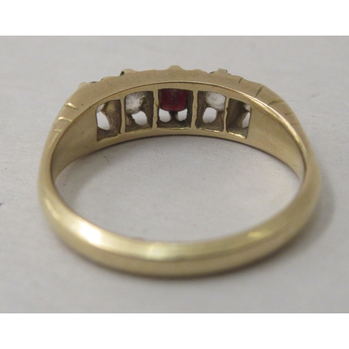 285 - An 18ct gold ring, set with diamonds and a red stone