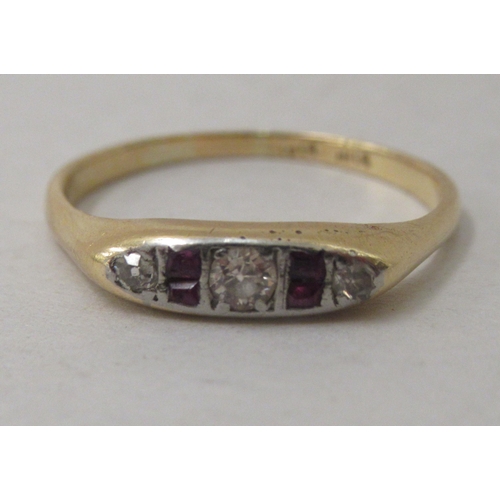 300 - An 18ct gold diamond and ruby ring