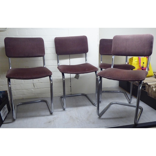 302 - A set of four modern tubular stainless steel framed and cantilevered office chairs with patterned re... 