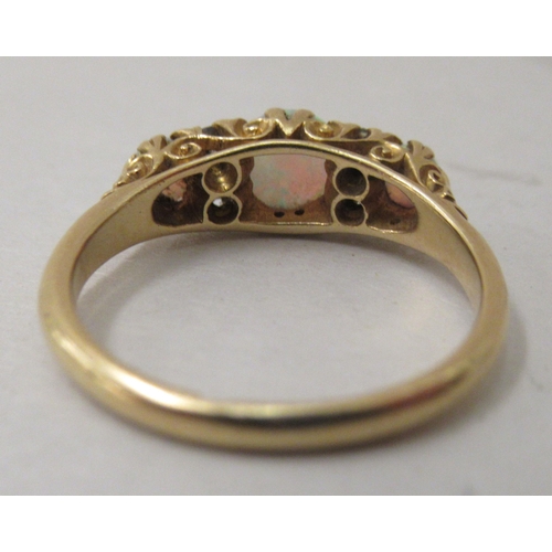 304 - An 18ct gold opal and diamond ring