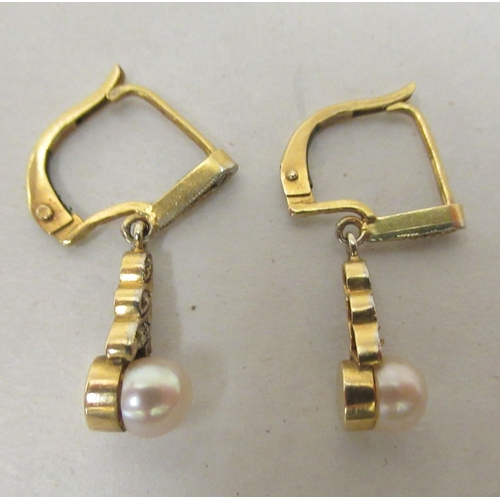 310 - A pair of yellow metal pearl drop earrings