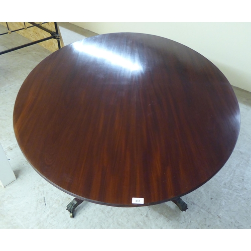 311 - A 20thC Regency style mahogany oval, tip-top breakfast table with a reeded edge, over a vase turned ... 