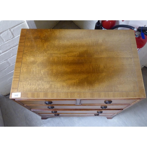 312 - A 19thC style, string inlaid and satin mahogany finished dressing chest, the two short/three graduat... 