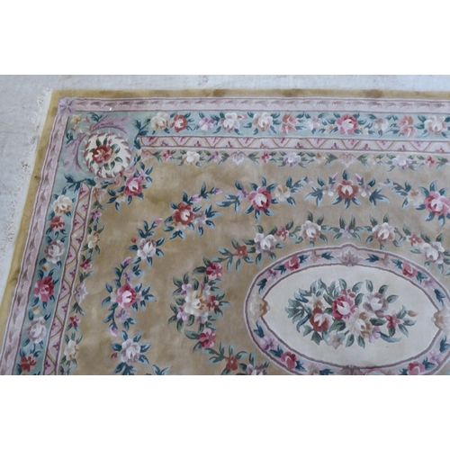 317 - A modern cotton carpet, decorated in pastel colours with floral designs  120