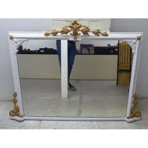 321 - A 19thC and later white painted and gilded overmantel mirror with gesso ornament  36