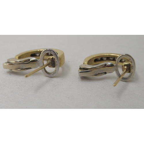 326 - A pair of 18ct gold diamond half hoop earrings