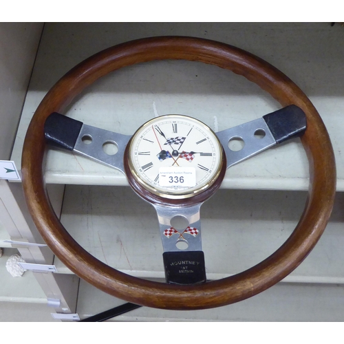 336 - A vintage steering wheel shaped clock with a quartz movement  13