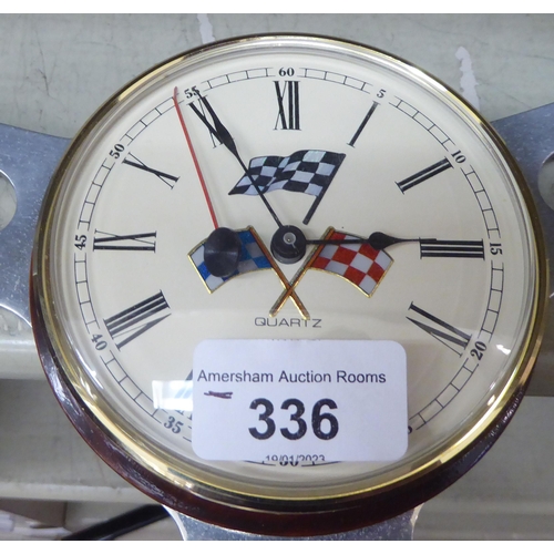 336 - A vintage steering wheel shaped clock with a quartz movement  13