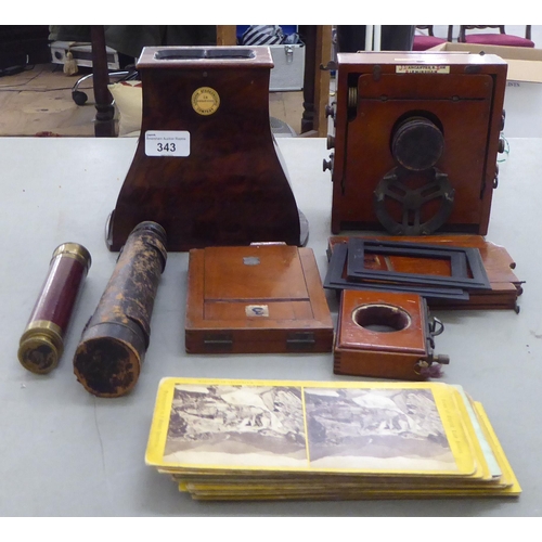 343 - Optical related collectables: to include a late Victorian stereoscopic viewer and contemporary viewi... 