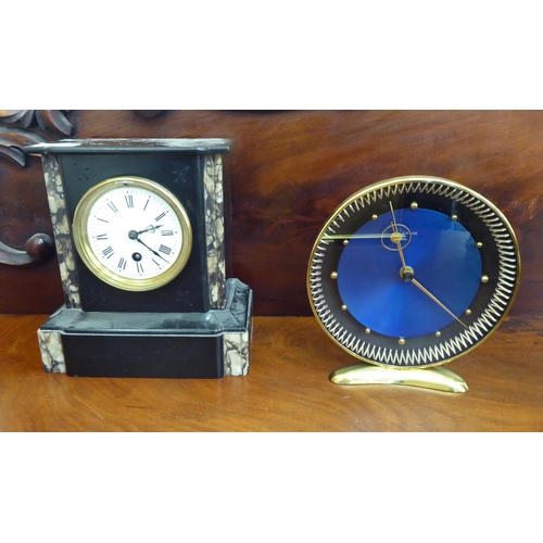 344 - Clocks and timepieces: to include a 1930s black slate cased example, faced by a Roman dial  9