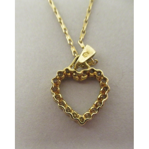 34 - An 18ct gold and diamond set heart shape pendant, on a fine neckchain and ring bolt clasp 