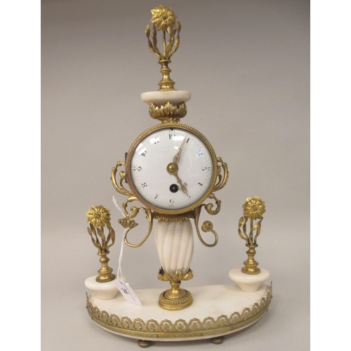 36 - A late 19thC Continental gilt metal and white alabaster pillar type mantel timepiece; the drum cased... 