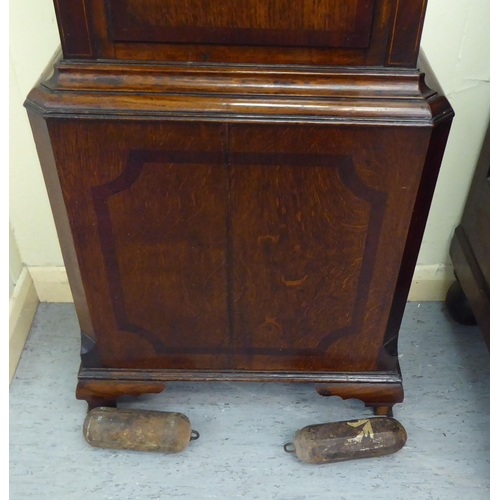 38 - An early 19thC mahogany longcase clock, having a swan neck pediment, flank pillars and an arched win... 