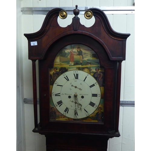 38 - An early 19thC mahogany longcase clock, having a swan neck pediment, flank pillars and an arched win... 