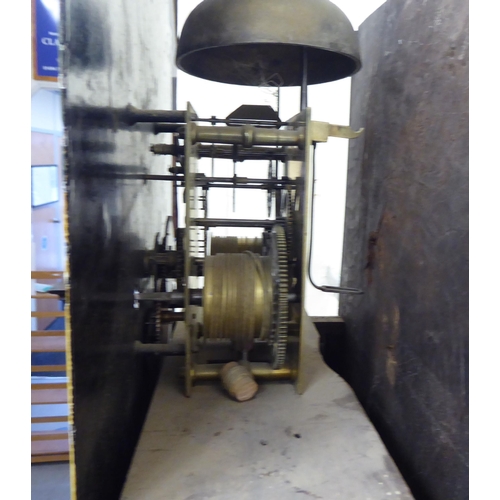 38 - An early 19thC mahogany longcase clock, having a swan neck pediment, flank pillars and an arched win... 