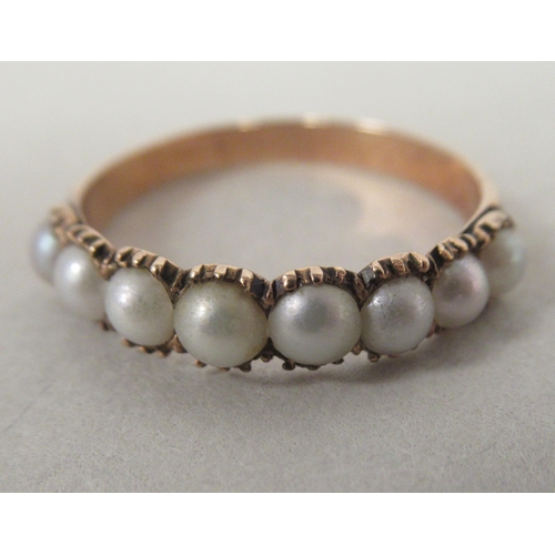 42 - A 9ct rolled gold ring, set with eight pearls