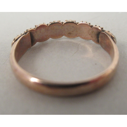 42 - A 9ct rolled gold ring, set with eight pearls