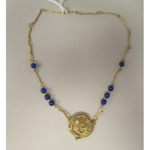 48 - An 18ct gold Scandinavian lapis lazuli and diamond set pendant, on a rod and ring link neckchain&nbs... 