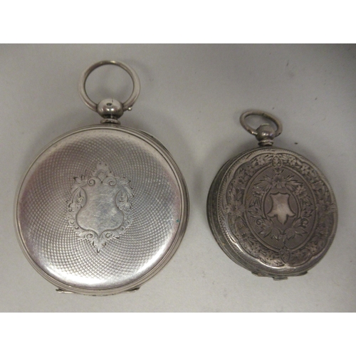 50 - A ladies engraved silver cased fob watch, faced by a Roman dial; and an engine turned silver cased p... 