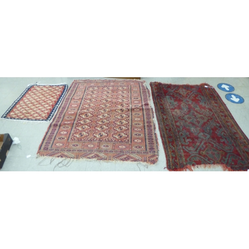 54 - Rugs: to include a Kilim examples with floral motifs, on a red and blue ground  37