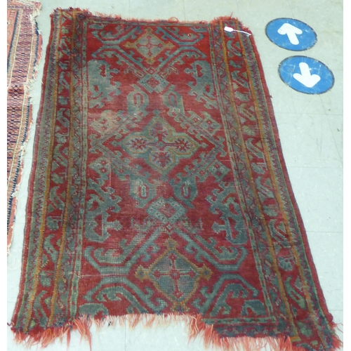 54 - Rugs: to include a Kilim examples with floral motifs, on a red and blue ground  37