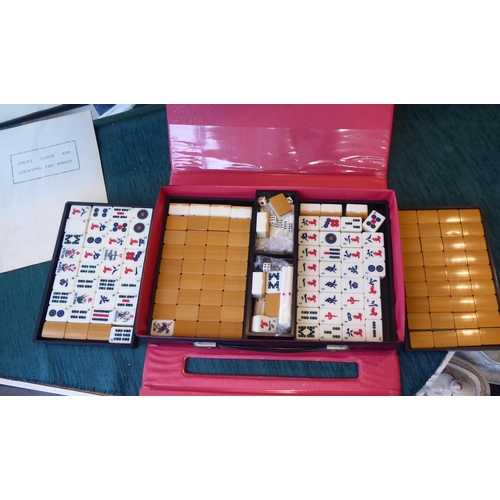 69 - A Mah-jong set with bamboo effect resin tiles, in a travel case