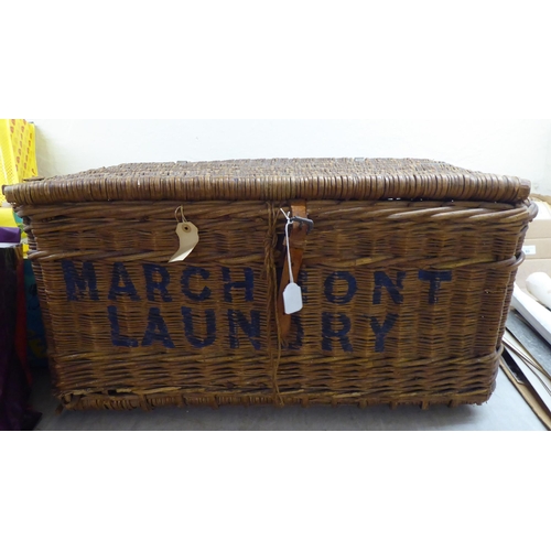 8 - An early 20thC woven cane basket, inscribed Marchmont Laundry  15