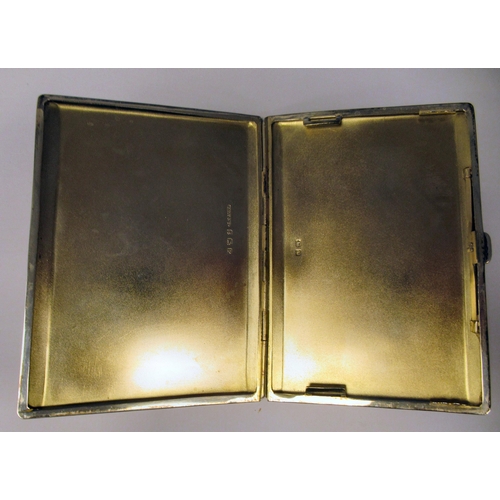 81 - A silver folding, engine turned cigarette case, on a button clasp  Birmingham 1939