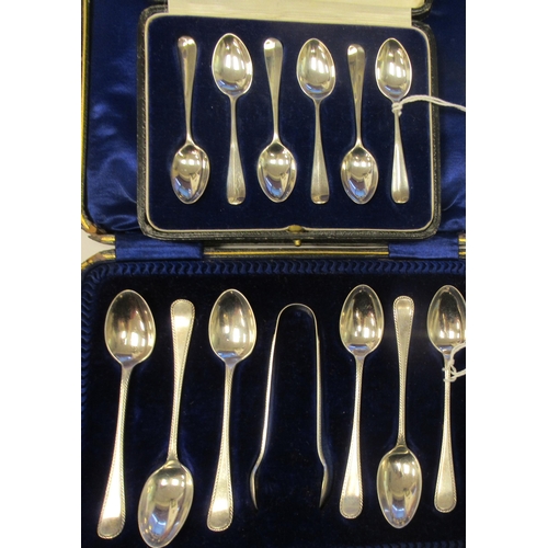 91 - A set of six silver Hanoverian rattail pattern coffee spoons  cased; and a set of six silver teaspoo... 