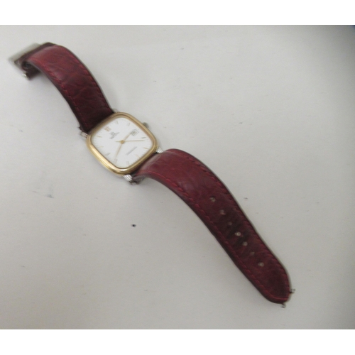 109 - A Zenith gold plated stainless steel cased composition wristwatch, faced by a baton dial with a date... 