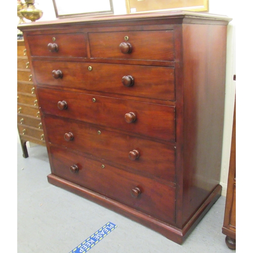 207 - A mid Victorian mahogany dressing chest, comprising two short/four graduated long drawers with bun h... 