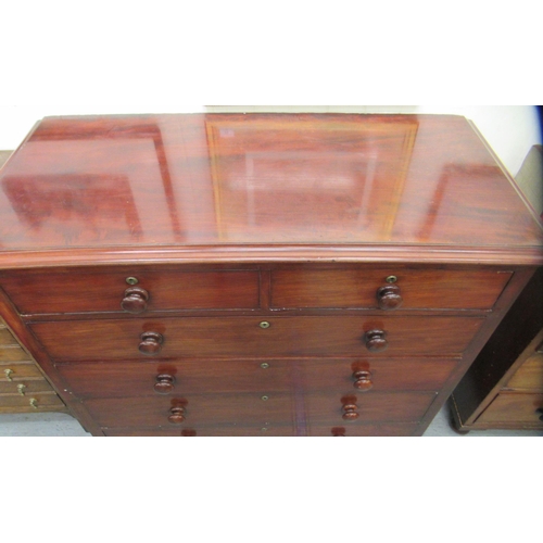 207 - A mid Victorian mahogany dressing chest, comprising two short/four graduated long drawers with bun h... 