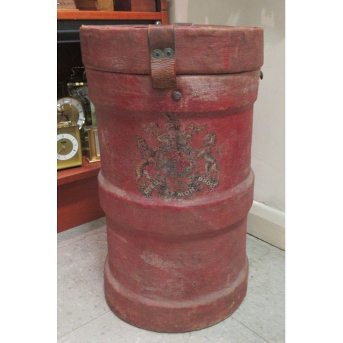 35 - A red canvas clad ammunition carrier and cover, decorated with a crest  21.5