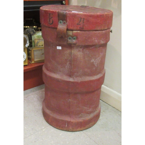 35 - A red canvas clad ammunition carrier and cover, decorated with a crest  21.5