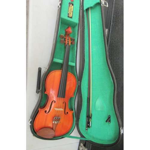 63 - A Stentor Music Company violin, the two piece back 13.5