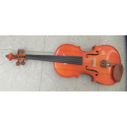 63 - A Stentor Music Company violin, the two piece back 13.5