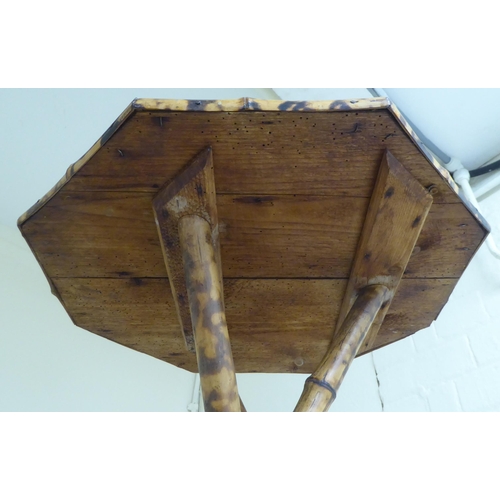 102 - A 20thC bamboo and rattan occasional table with an octagonal top, raised on a crossover tripod base&... 