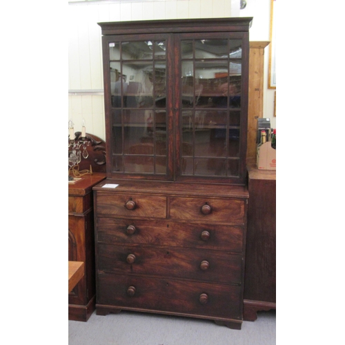 119 - A George III mahogany cabinet with a pair of glazed doors, over two short/three long drawers, raised... 