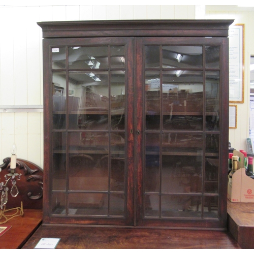 119 - A George III mahogany cabinet with a pair of glazed doors, over two short/three long drawers, raised... 