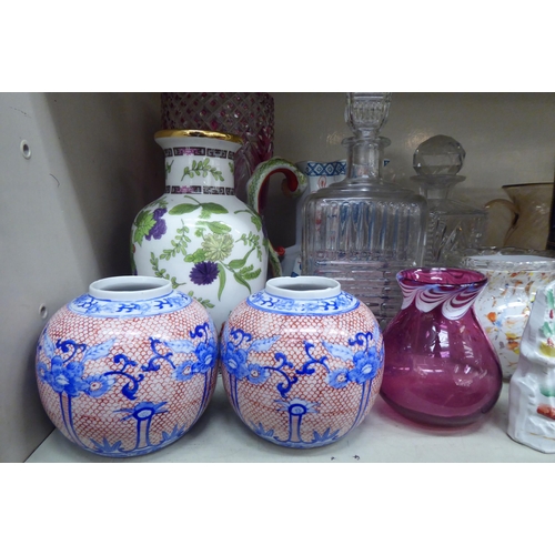 127 - Decorative ceramics and glassware: to include a clear and cranberry coloured vase  10.5