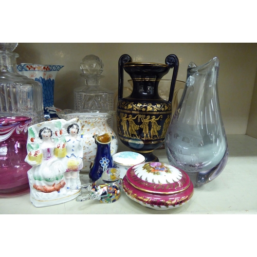 127 - Decorative ceramics and glassware: to include a clear and cranberry coloured vase  10.5