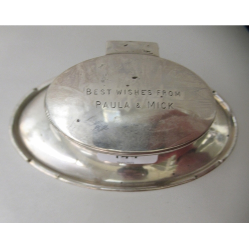 144 - A silver capstan design inkwell of oval form with a hinged lid  Birmingham marks rubbed  6... 