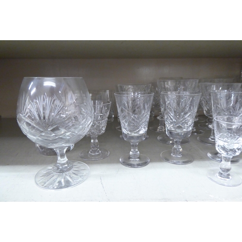 156 - Glassware: to include pedestal wines and tumblers with star cut decoration